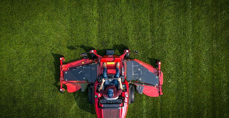 aerial view of man mowing the grass